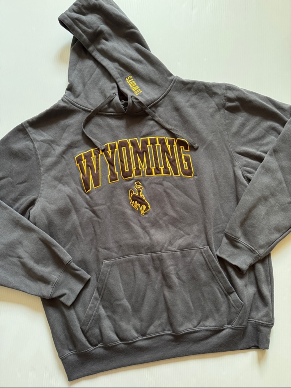 Wyoming Cowboys Gray Hooded Sweatshirt with Gold Lettering.  Men’s size XL